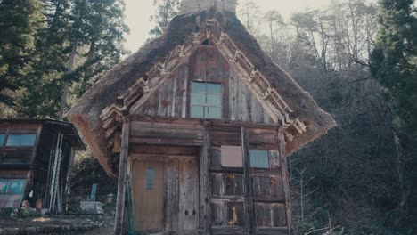 wooden with steep thatched roof house at shirakawa-go hamlet in shirakawa, japan