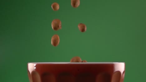 japanese peanuts falling on a plate