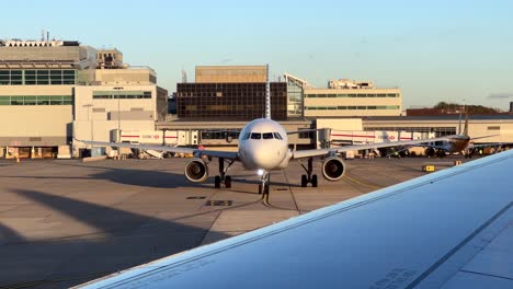 Aircraft-moving-and-taxiing-on-tarmac-at-Gatwick-airport-in-London