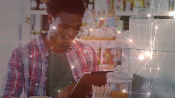 Animation of network of connections over businessman using tablet