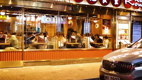 diners enjoy meals inside a bustling restaurant