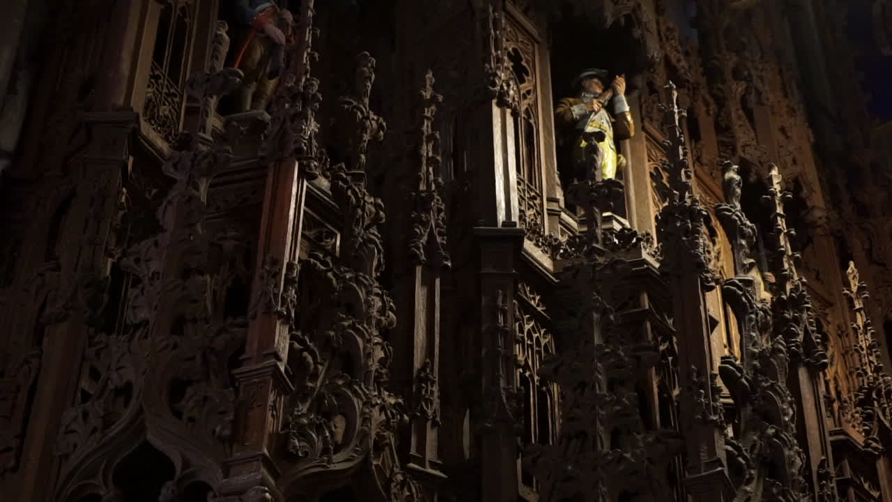 Carved wooden reredos with ornate patterns and depiction of a American revolutionary war soldier