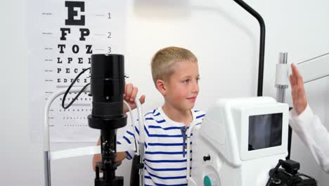 Optometrist-giving-high-five-to-young-patient