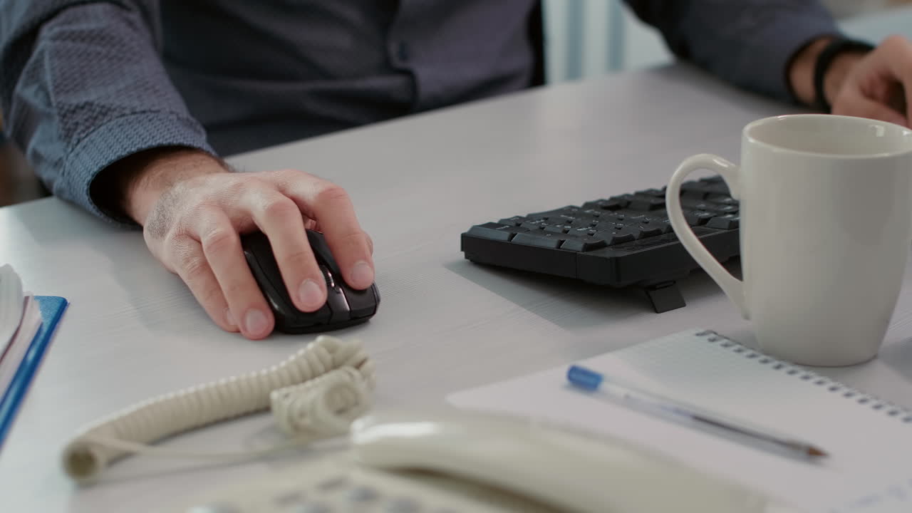 Sales consultant analyzing business statistics on computer