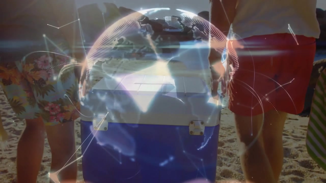 Dos amigos colocando una nevera azul y blanca en la arena, revelando una red global giratoria para la tecnología.