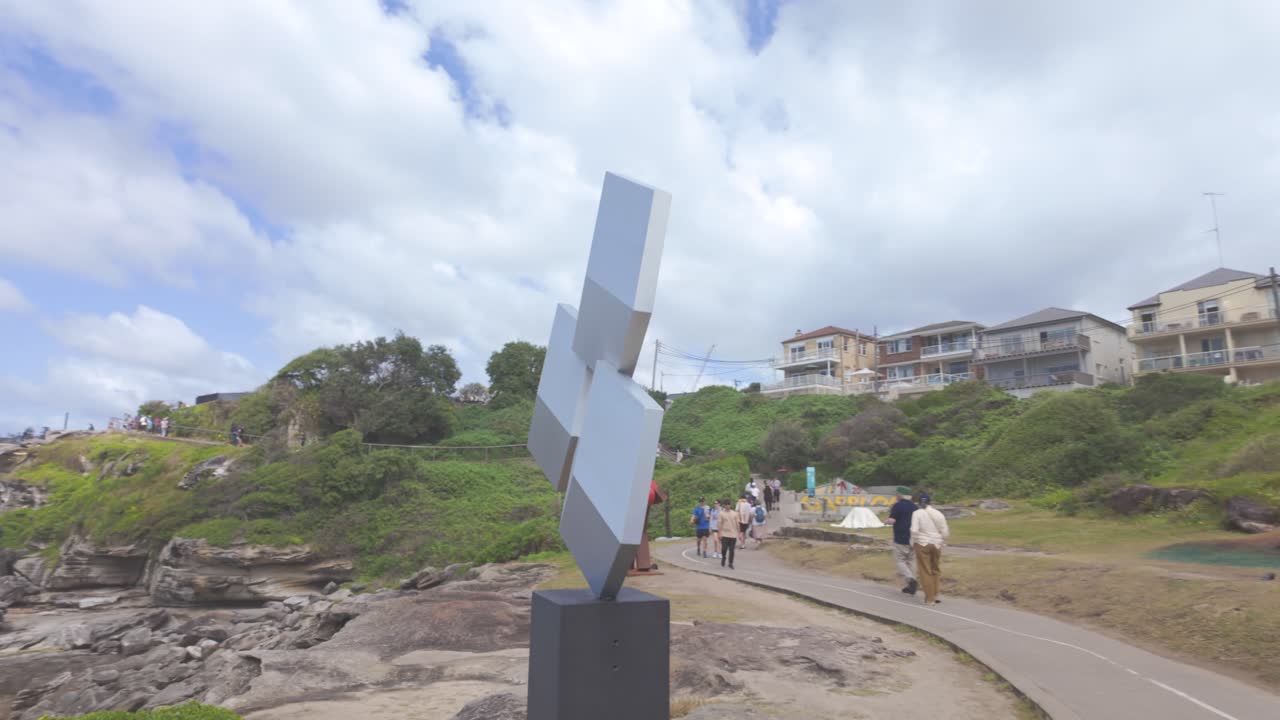 Shadows of Perception, crafted from aluminium and galvanized mild steel. Sculpture by the sea Bondi 2024, Sydney NSW, Australia. Panning to the left.