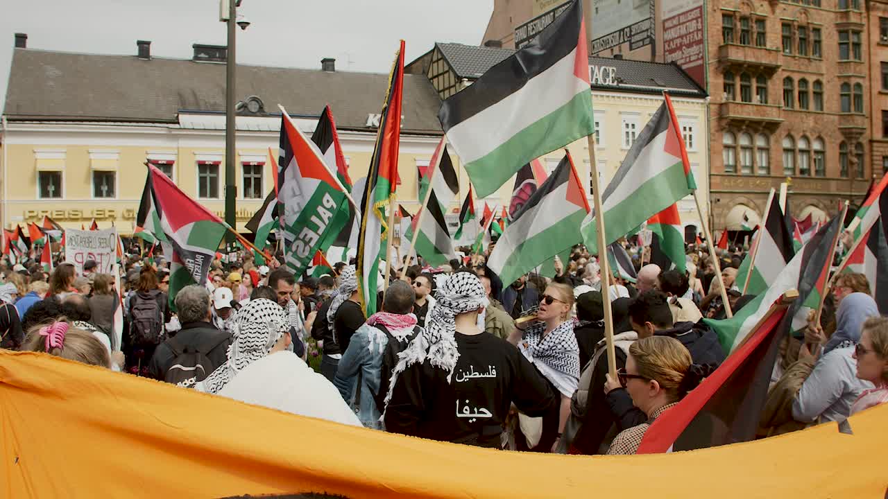 Pro Palestine protesters march against Israel’s Eurovision participation in Malmö (Sweden), calling for a ceasefire on the war in Gaza, Eurovision song contest 2024, wide handheld shot