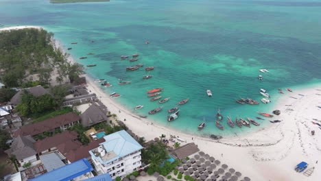 Top-view-of-the-fishing-boats-on-tropical-sea-coast-with-sandy-beach