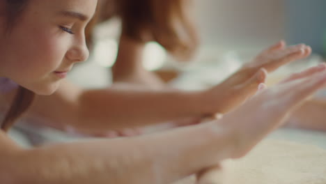 girl rolling pizza dough