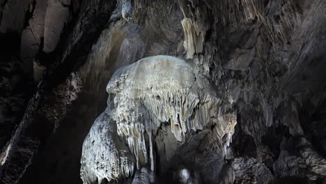 slow tilt, draperies and stalactites in belgian caves, grottes de han