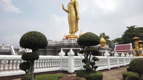 Giant-Gold-Standing-Buddha-Statue,-Outdoor