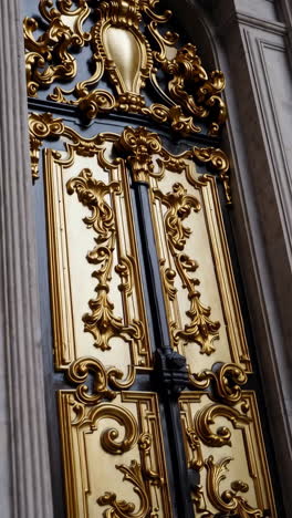 ornate gold and black church doors