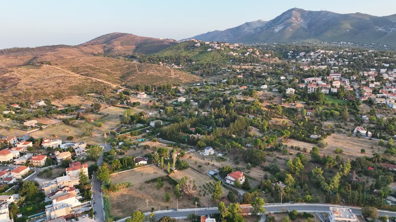 Aerial footage over houses in the mountain in the north of Athens, Greece