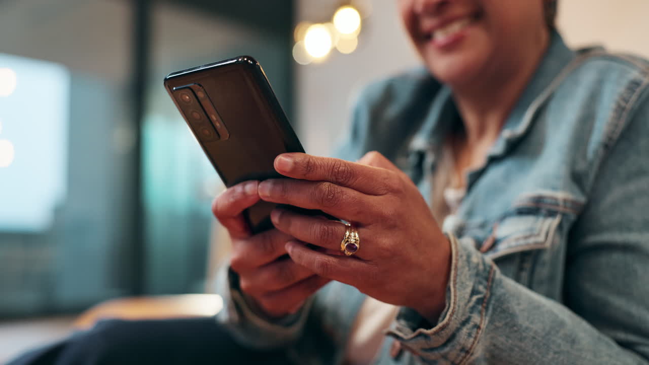 Woman using smartphone indoors