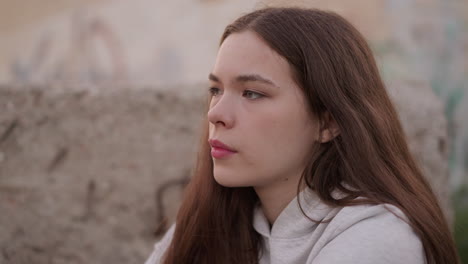 lady grapples with life difficulties among concrete rocks. depressed young woman struggles coping with negative emotions. addressing mental health issues