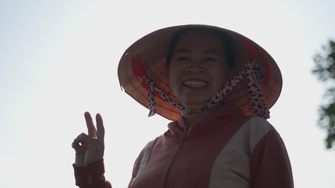 Smiling Woman in Conical Hat