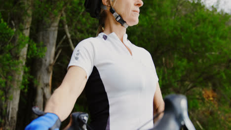 senior cyclist standing with bicycle at countryside 4k