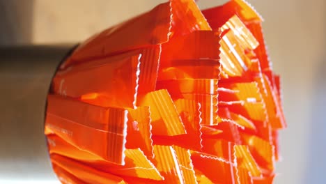 orange packets in container