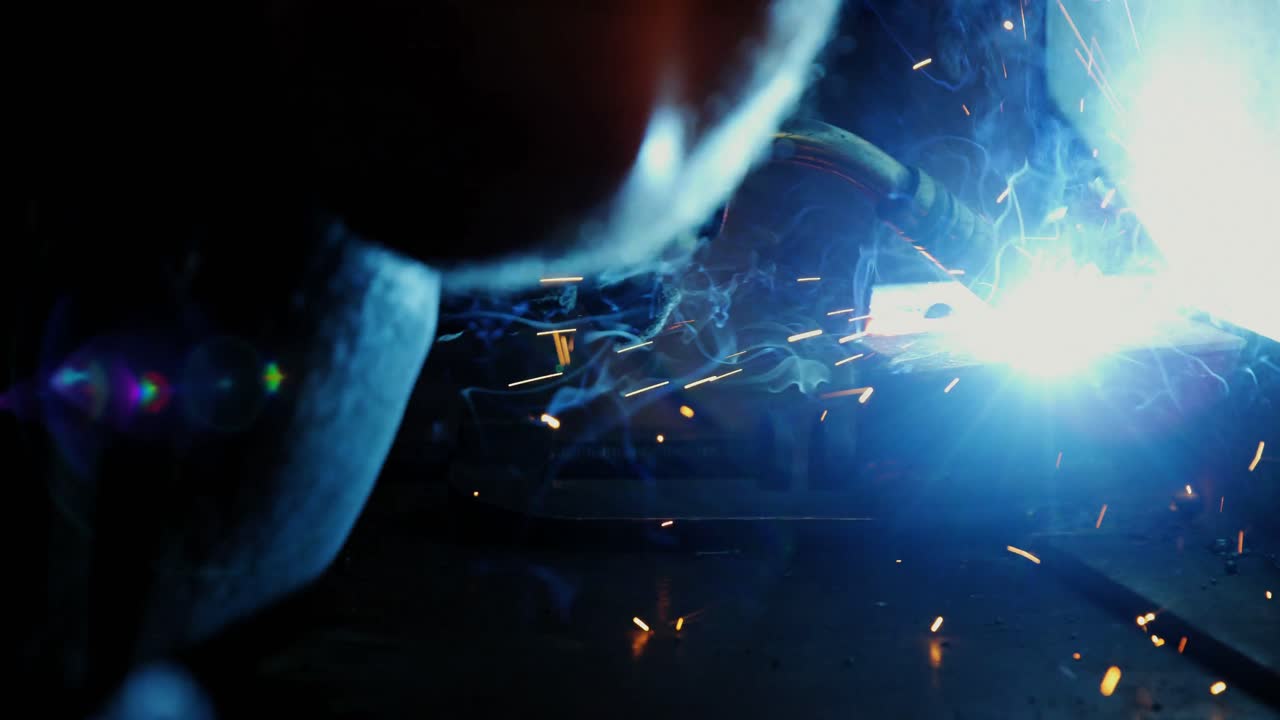 Welder welding a metal