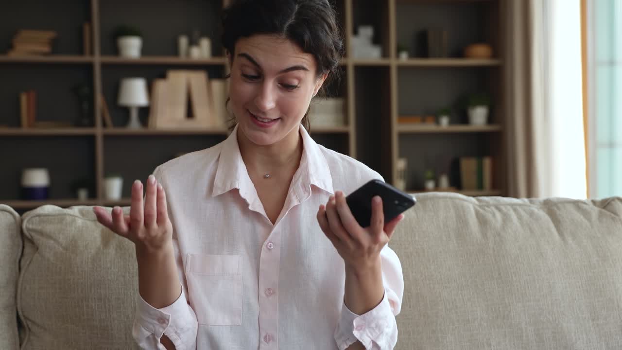 Woman feels irritated looks angry with bad news by sms