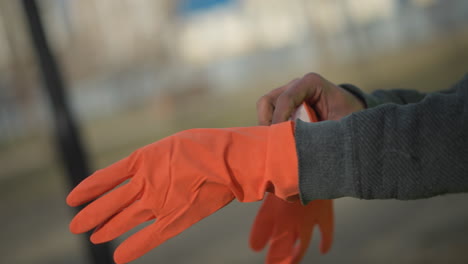 close-up of unzipped high visibility safety vest in bright fluorescent yellow with silver reflective stripes, revealing black textured inner clothing, designed for worker safety in construction environments