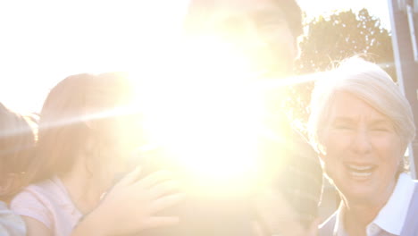 portrait of extended family group in garden, slow motion