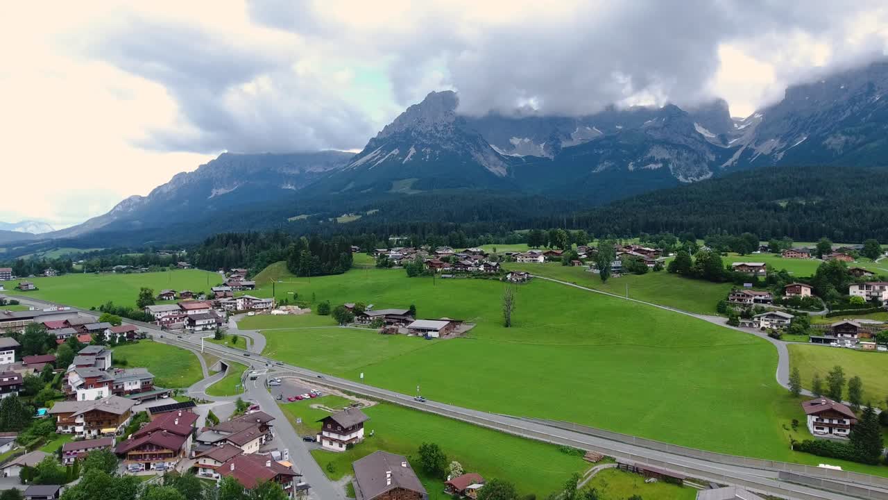 AERIAL - Flight with the DJI Phantom 4 in Going at the Wilder Kaiser with view of the Kaiser mountains