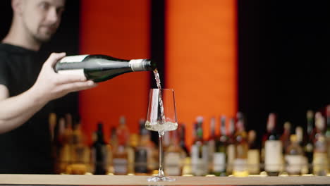 bartender pouring white wine