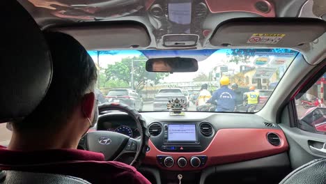 driver navigating traffic in hanoi, vietnam