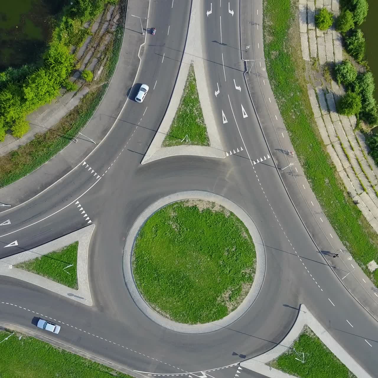 Circular Movement At The Traffic Intersection. Aerial view of roundabout in the city in the summer in Ukraine