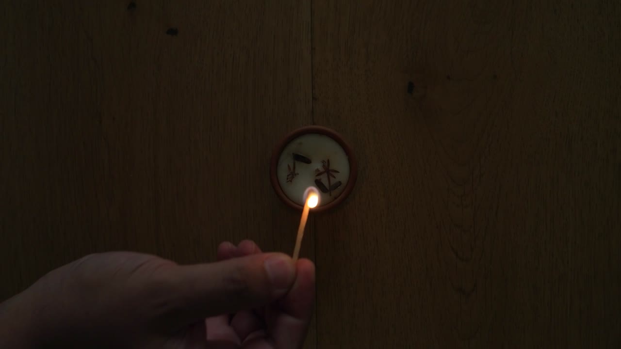Human hand lighting/ blowing off a Diya or a tradition lamp used for various Hindu festive celebrations, the festival of light- Diwali and also for others like Dussehra or prayers at home or temple