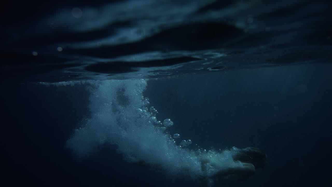Person Diving Underwater