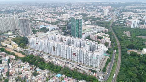 aerial flying backwards, moving away from residential complex on cloudy day