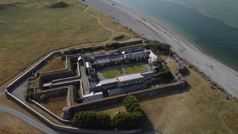 fort belan, napoleonic fort on the welsh coast and overlooking the menai strait, abermenai point and anglesey, gwynedd, wales