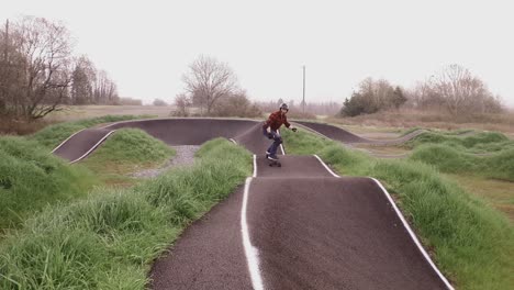 Eboarding-footage-around-a-BMX-pump-track