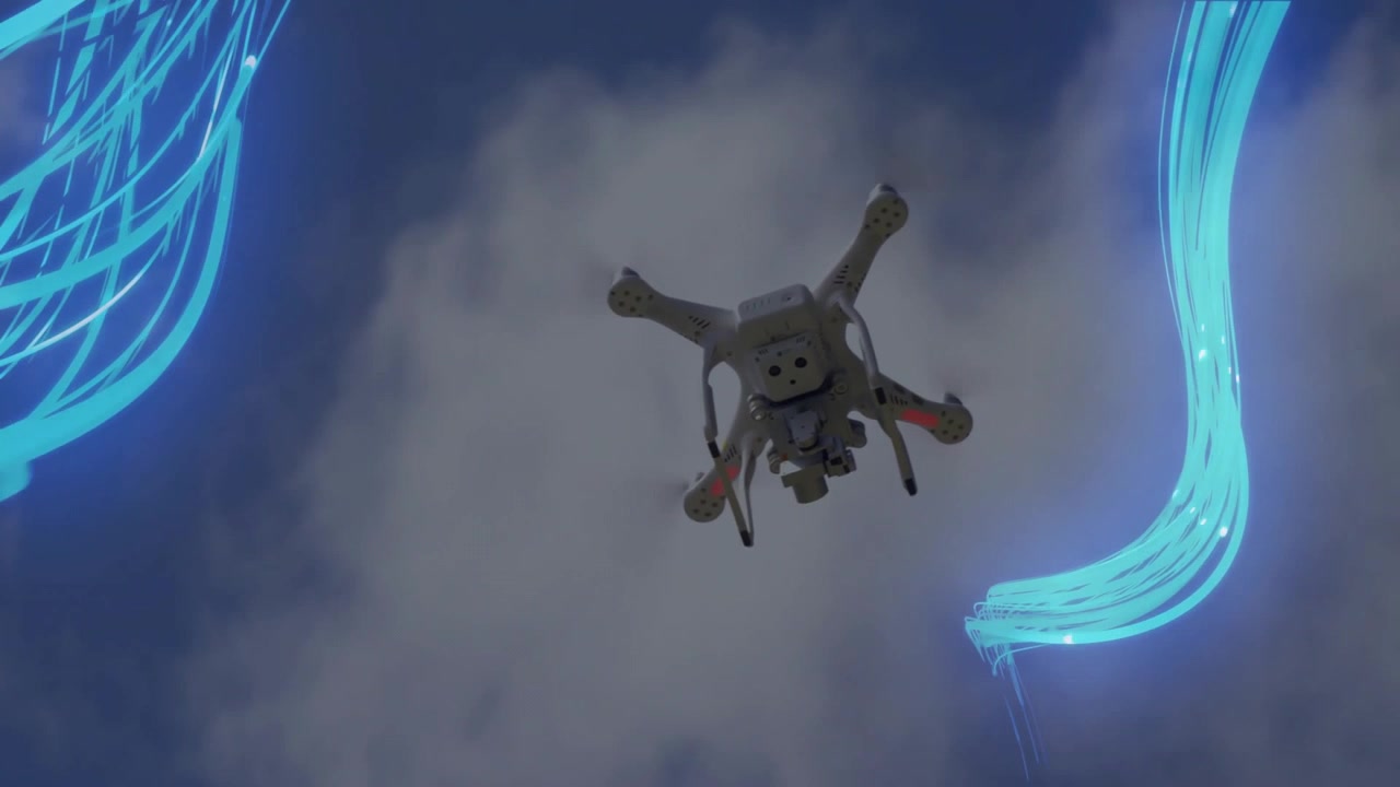 Drone kommer ind, stiger op i hvirvlende luftstrømme, svæver med pulserende LED-lys, vipper og demonstrerer stabilitet.