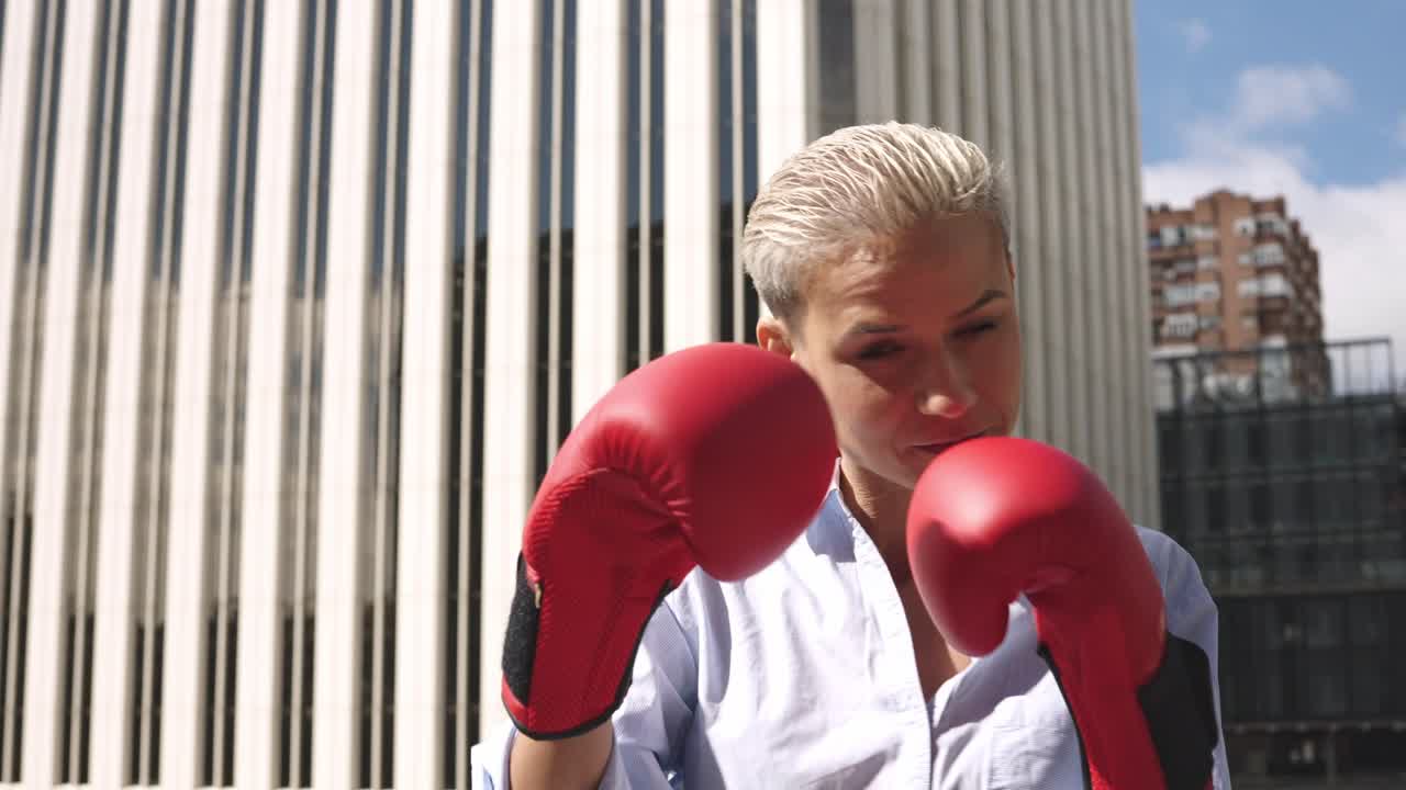 Determined Businesswoman with Boxing Gloves