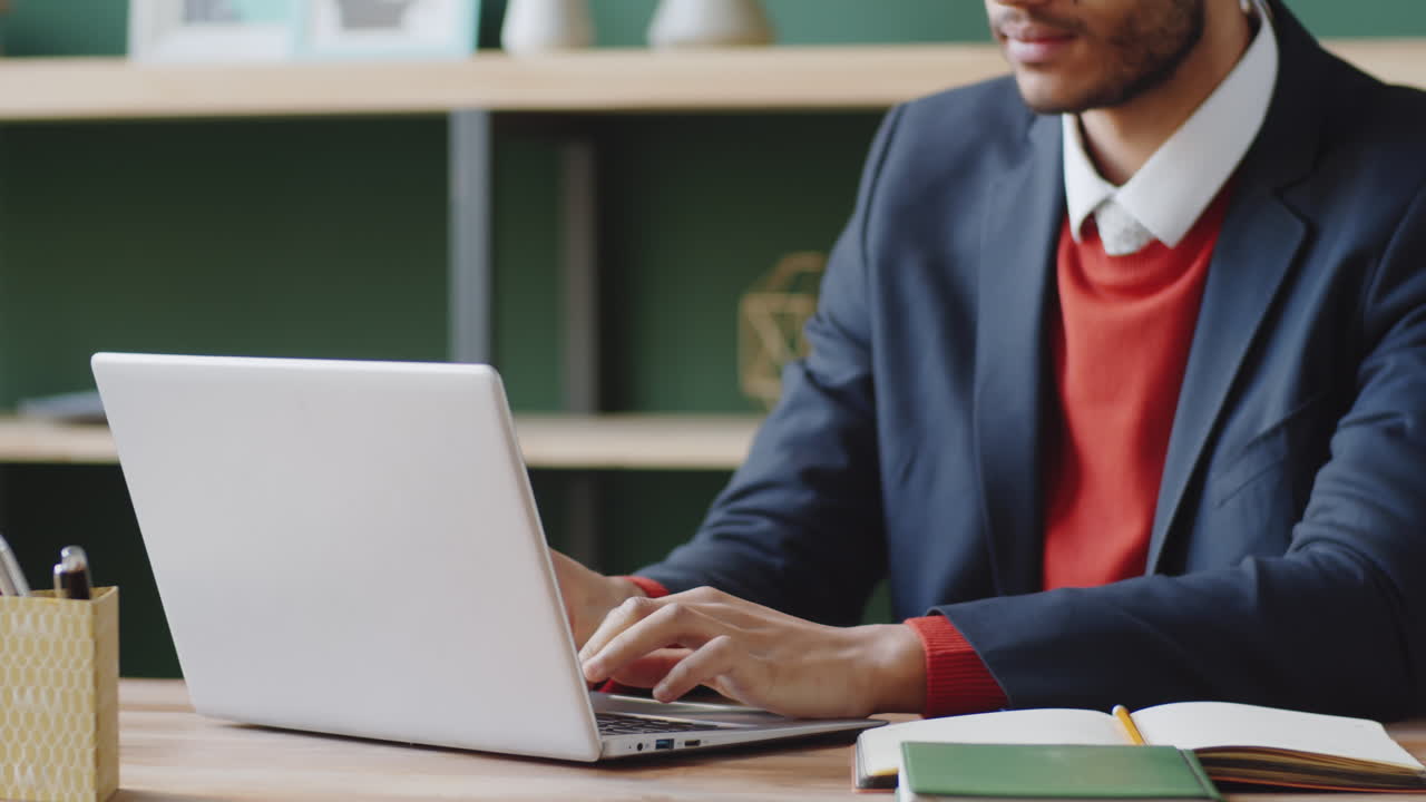 Man working on laptop in a modern office