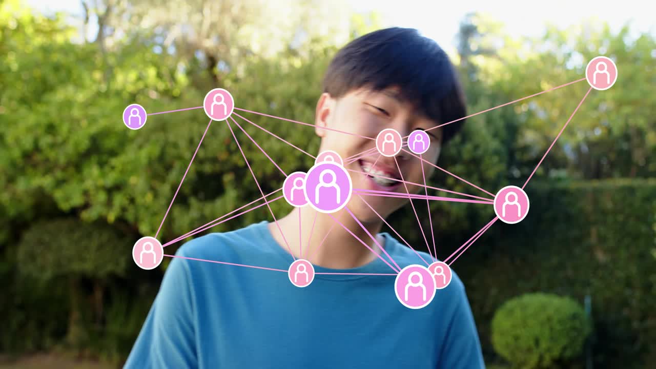 Man standing in yard, social network emerging to chest, causing turning and smiling, showing links