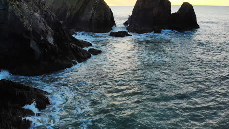 Rock-formation-in-sea-at-dusk-4k