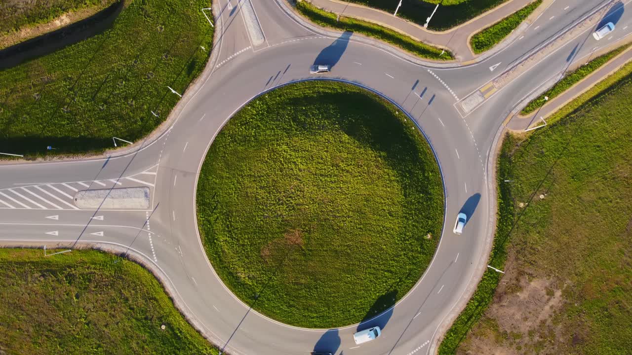 Country road with roundabout in Latvia, aerial top down view
