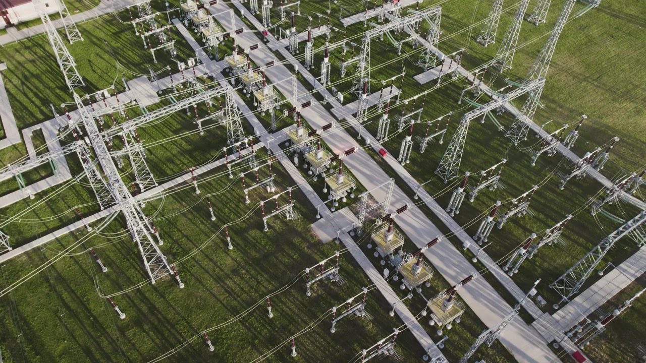 Aerial View of Electrical Substation with Power Lines and Transformers