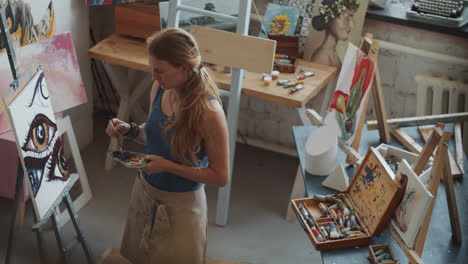 woman painting in an art studio