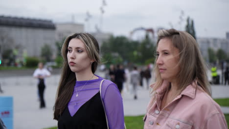 two women walking outdoors