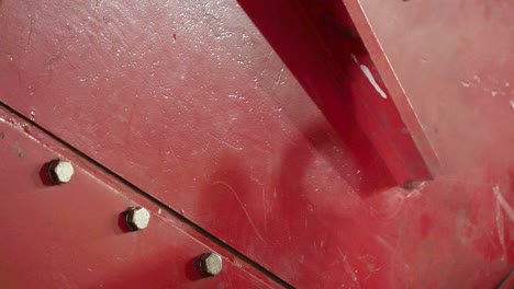 close-up of red industrial metal parts