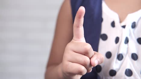 child pointing with index finger