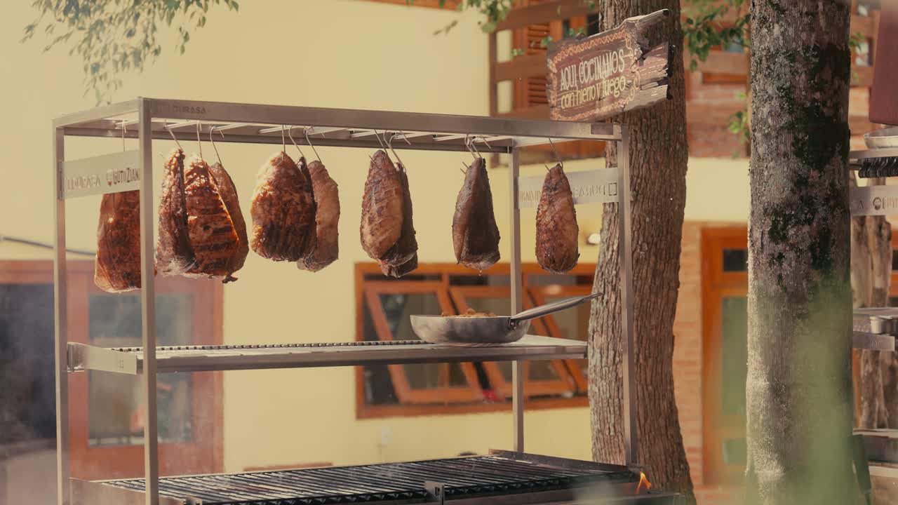 Pieces of beef, picanha, hanging on a barbecue gourmet station
