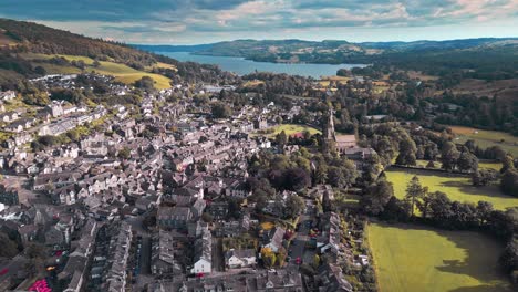 aerial drone footage of ambleside, a small village town on the banks of lake windermere, lake district, england