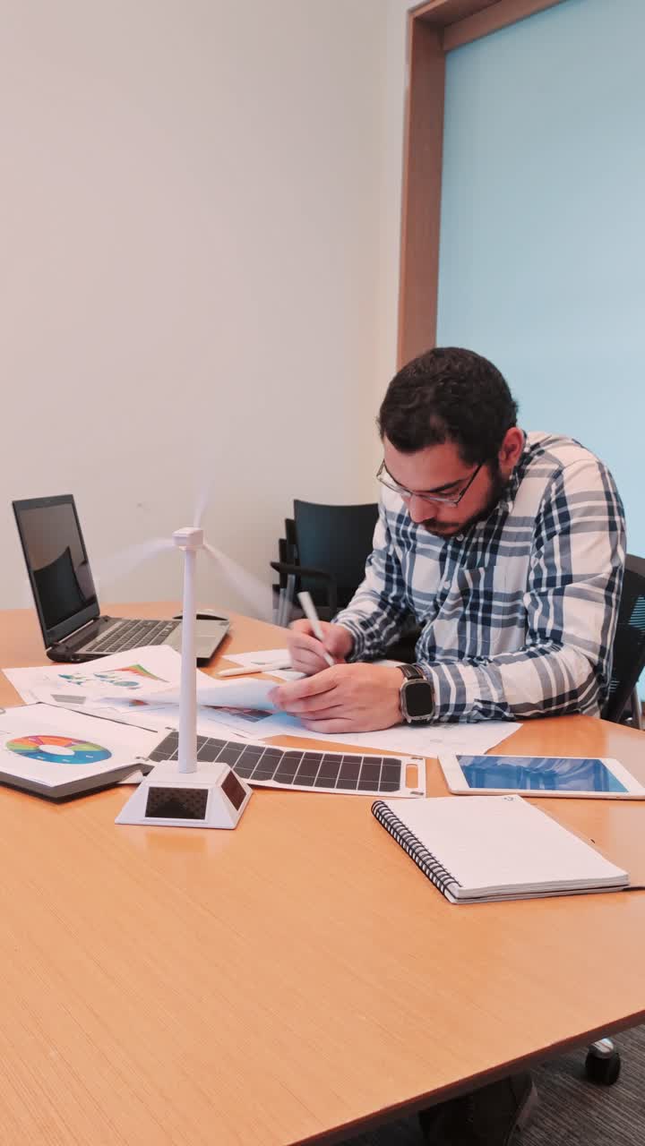 Creative Architect Sketching Designs for a Sustainability Project