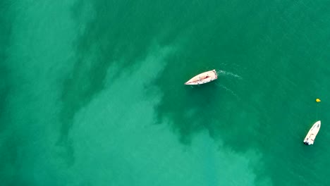 aerial view of boat sailing in the persian gulf in dubai, u.a.e.